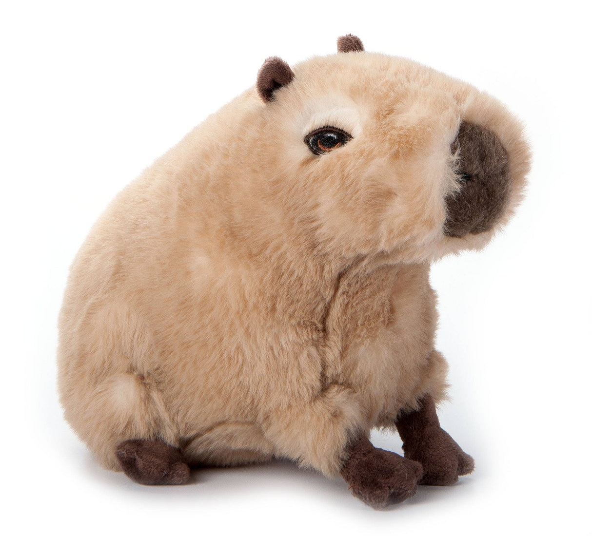 The Plush: Capybara Earth Keeperz Capybara Stuffed Animal (10 long) features light brown fur, dark brown feet, and rounded ears. It sits upright on a white background and is made from recycled materials for eco-friendly cuddles.
