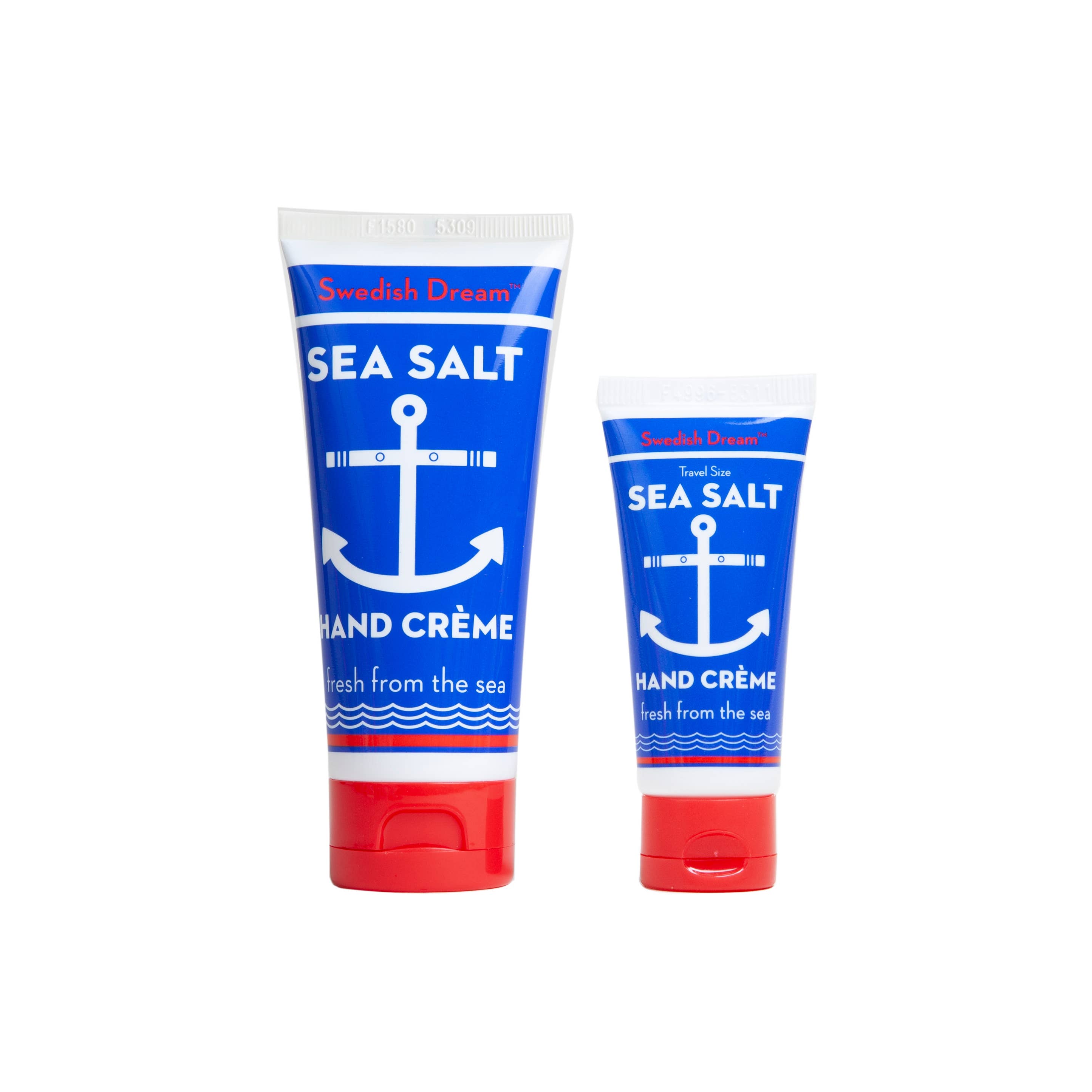 Two tubes of Swedish Dream Sea Salt Hand Crème, one in a large size and one as the convenient Sea Salt Hand Cream Pocket Size .75 fl, both showcase elegant blue packaging adorned with an anchor design and finished with red caps. Perfectly sized for any journey, the travel-sized crème ensures your hands stay nourished wherever you go.