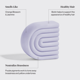 The Kitsch Hair Purple Toning Shampoo & Conditioner Bar Combo (2 x 2.7 oz) features lavender-toned bars with orange blossom and jasmine scent, biotin for healthy hair, and purple pigments to tone brassiness in color-treated or grey hair.