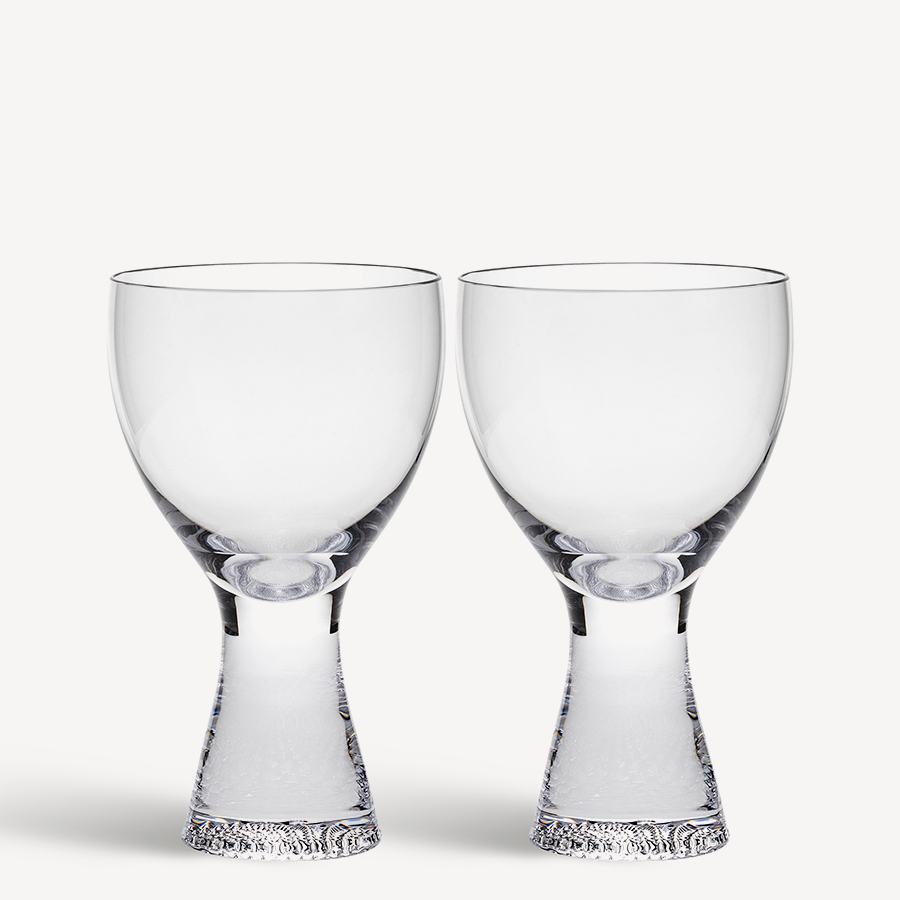 The KostaBoda Limelight Wine Clear 2-Pack features two stylish, stemless wine glasses with textured bases. Both dishwasher safe, they offer a blend of elegance and practicality for any occasion.
