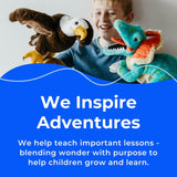 A smiling child holds a Mermaid Plush Doll with Braids & Sea Turtle from Faire - The Petting Zoo above a blue banner that reads, “We Inspire Adventures.” Alongside their sea turtle companion, this plush helps teach important lessons—blending wonder with purpose to help children grow and learn.