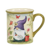From our Enchanting Collection, the 14 oz Garden Gnome Mug is available in four colors/patterns, each featuring a whimsical gnome gardening among flowers and butterflies and finished with a vibrant green handle.