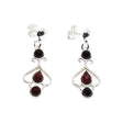 Cherry Baltic Amber Sterling Silver Dangle Earrings featuring three cherry amber gemstones— a teardrop-shaped center stone and round stones at the top and bottom.