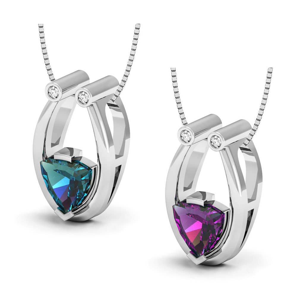 This silver necklace features a heart-shaped, color-changing Alexandrite pendant with a small round diamond above—a perfect gift for June birthstone lovers.