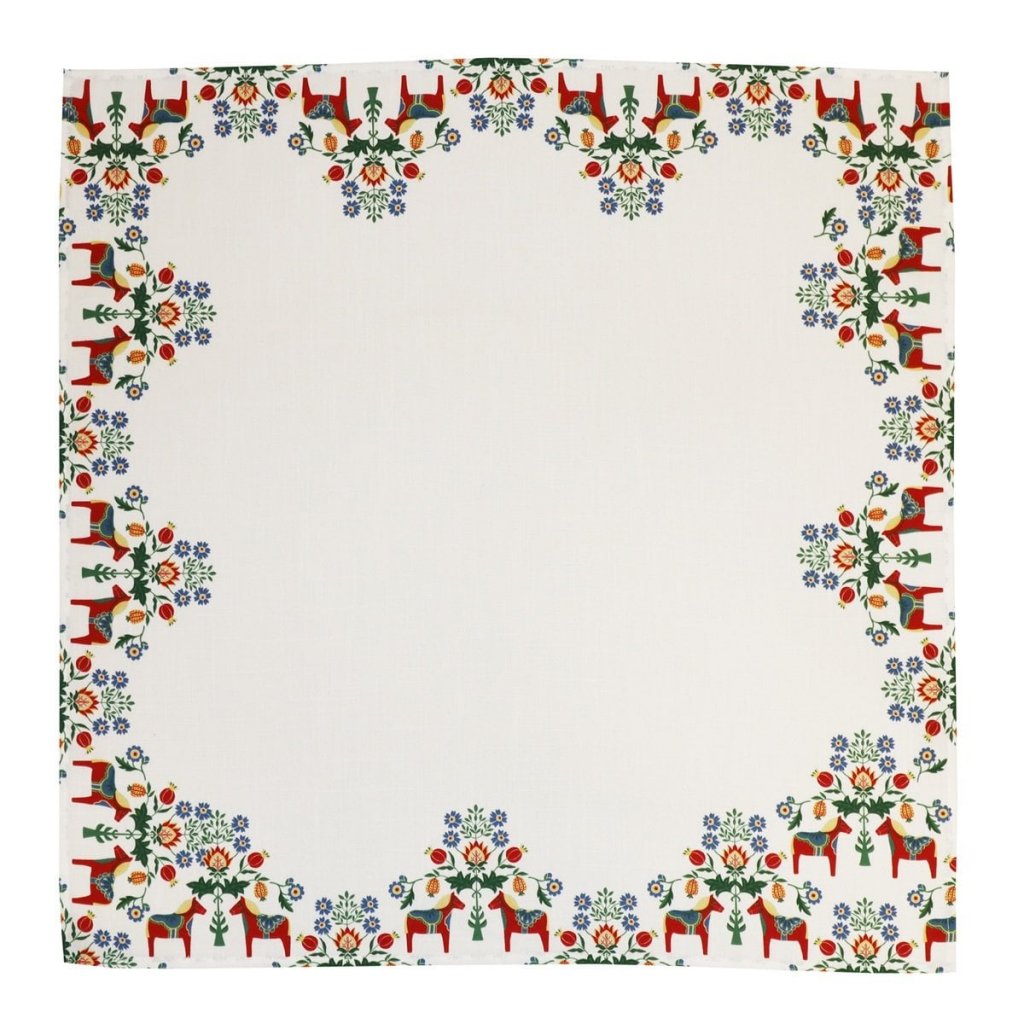 The Tablecloth: Dala Horse and Kurbits Tablecloth is a white square cloth with a border of red horses and green, blue, yellow, and red floral motifs arranged symmetrically along the edges.