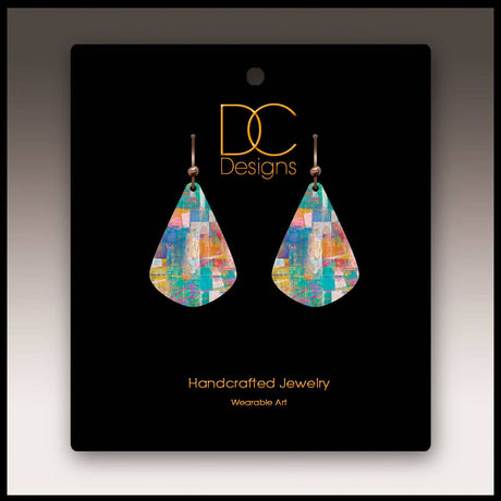 A pair of Mosaic Abstract Short Drop Handmade Earrings, teardrop-shaped, displayed on a black card labeled DC Designs Handcrafted Jewelry Wearable Art.