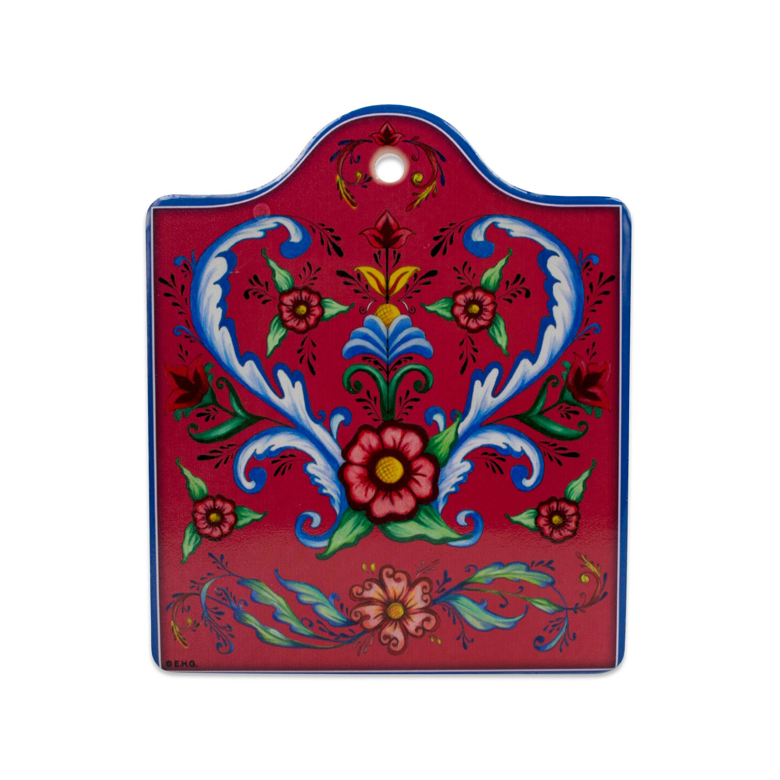 The Tile: Red Rosemaling Ceramic Cheeseboard w/ Cork Backing features traditional floral folk art in blue, red, green, and yellow on a red background. Use as a cheeseboard or trivet; includes a top hole for hanging. Perfect for Scandinavian kitchen decor.