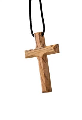 A Small Plain Wood Cross Pendant, 3 handcrafted from olive wood, hangs on a black cord and is shown isolated on a white background.