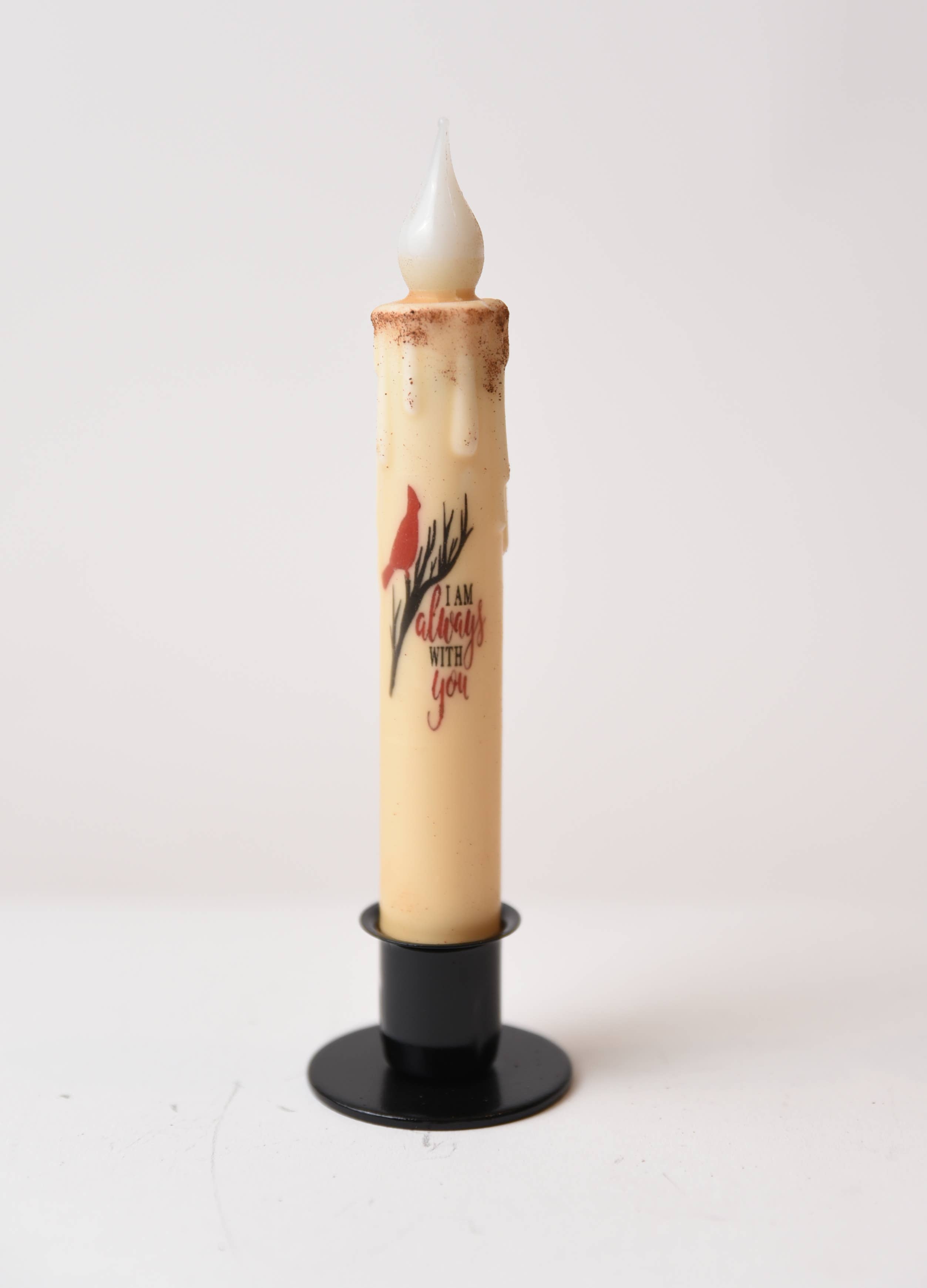 Add a farmhouse touch with the Candle: I am Always with You Cardinal LED Timer Taper Candle, cinnamon dusted and battery operated, featuring the "I am always with you" text on a black stand against a white background.