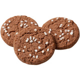 Three round cocoa cookies with cracked surfaces and pearl sugar on top, arranged on a plain white background.