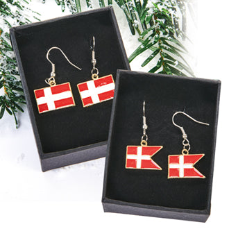 Two pairs of "Earring: Danish Flag" with red and white flag designs are shown in black boxes beside evergreen branches.