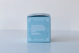 A light blue box with a white decorative border and a quote, featuring the Soap: Coastal Vibes Bath Bomb—handmade in Virginia Beach for skin nourishment—displayed against a plain white background.