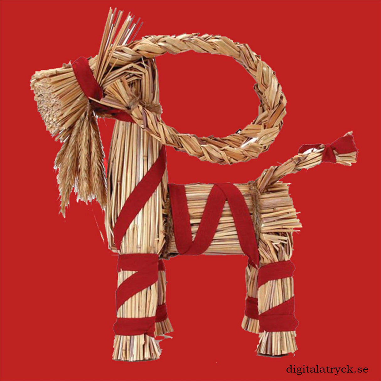Straw Swedish Yule goat with red ribbons wrapped around its body and legs, positioned on a solid red background.