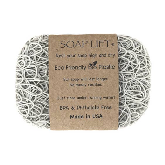 Soap Lift: The Original Soap Lift Soap Saver is a rectangular gray soap saver made from eco-friendly, intertwined bioplastic. BPA & phthalate free, it comes with a brown paper wrapper displaying product details.