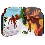 Open Christmas reindeer board book featuring an illustration of a small reindeer flying in the snow with two adult reindeer standing beneath a Christmas tree.