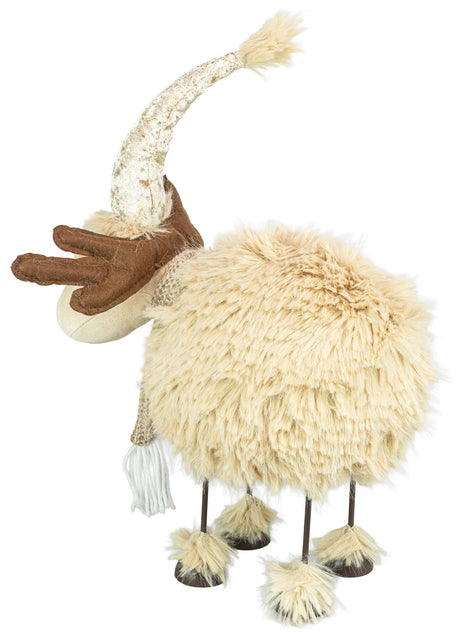 Plush tan reindeer figurine with long legs, brown antlers, and a cream hat and scarf, shown in profile view against a white background.
