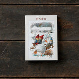 Product box labeled “Nisser” featuring three gnome-like children in red hats riding a goose, styled after traditional Scandinavian holiday art.
