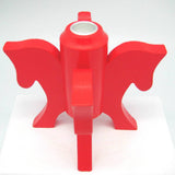The Swedish Red Dala Horse Candle Holder features four horse heads in an abstract design with a cylindrical center, ideal for Scandinavian decor and displayed on a white surface.
