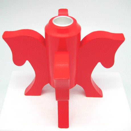 The Swedish Red Dala Horse Candle Holder features four horse heads in an abstract design with a cylindrical center, ideal for Scandinavian decor and displayed on a white surface.