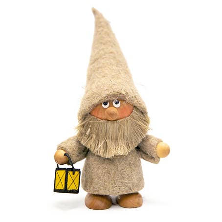 A charming Scandinavian handcrafted gnome figurine, with a long beard and tall pointed hat, holding a radiant yellow lantern.