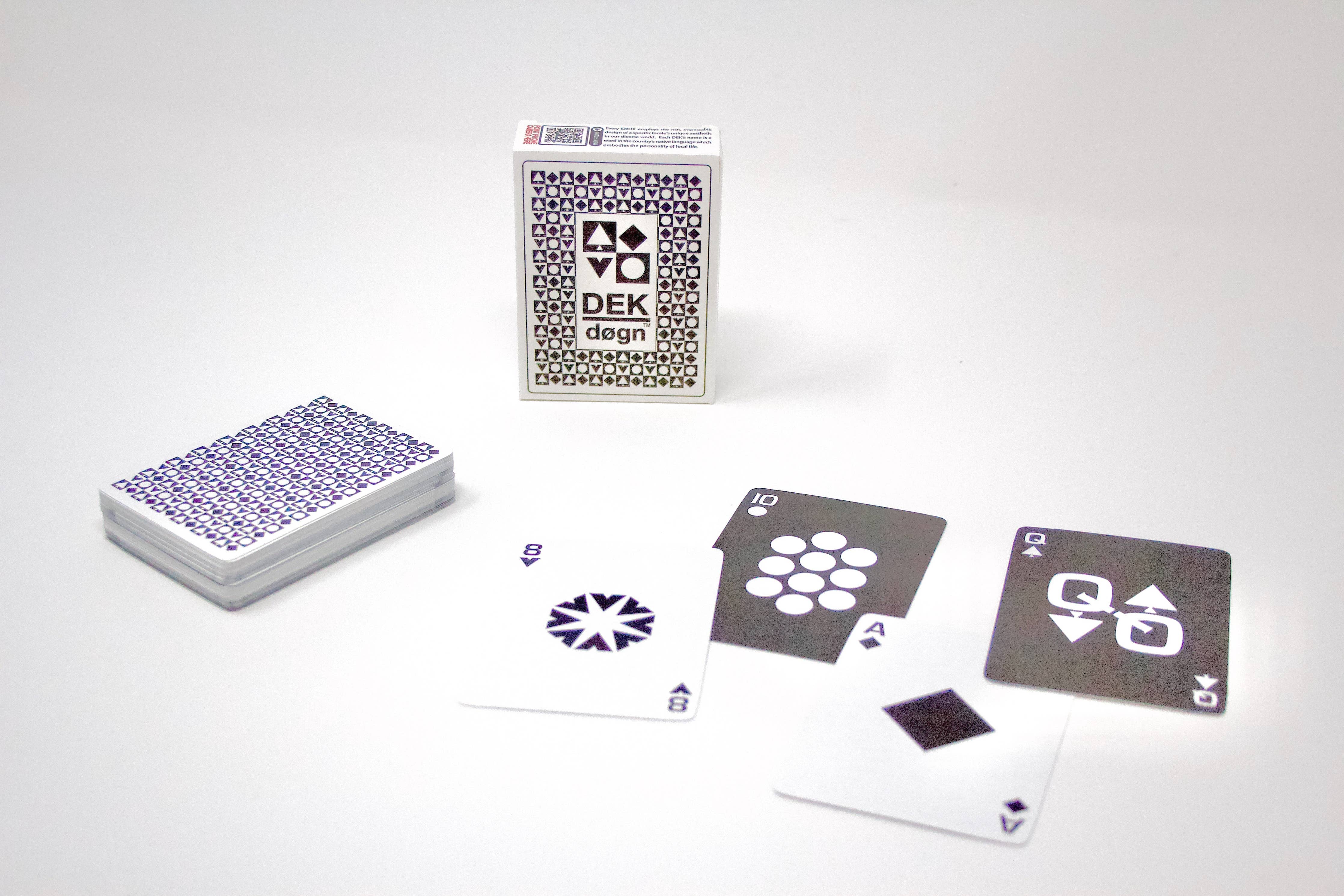 A deck of Playing Cards: DEK Døgn (Norway) presents a unique aesthetic, showcasing four face-up cards with abstract designs and an eye-catching box featuring a geometric pattern inspired by Norwegian design.