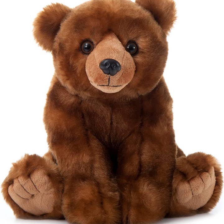 The 12" (25cm) Wild Onez Brown Bear is a plush teddy bear made from recycled fabrics, showcasing a soft, fuzzy texture with round black eyes and a stitched nose. This charming bear sits upright, facing forward.