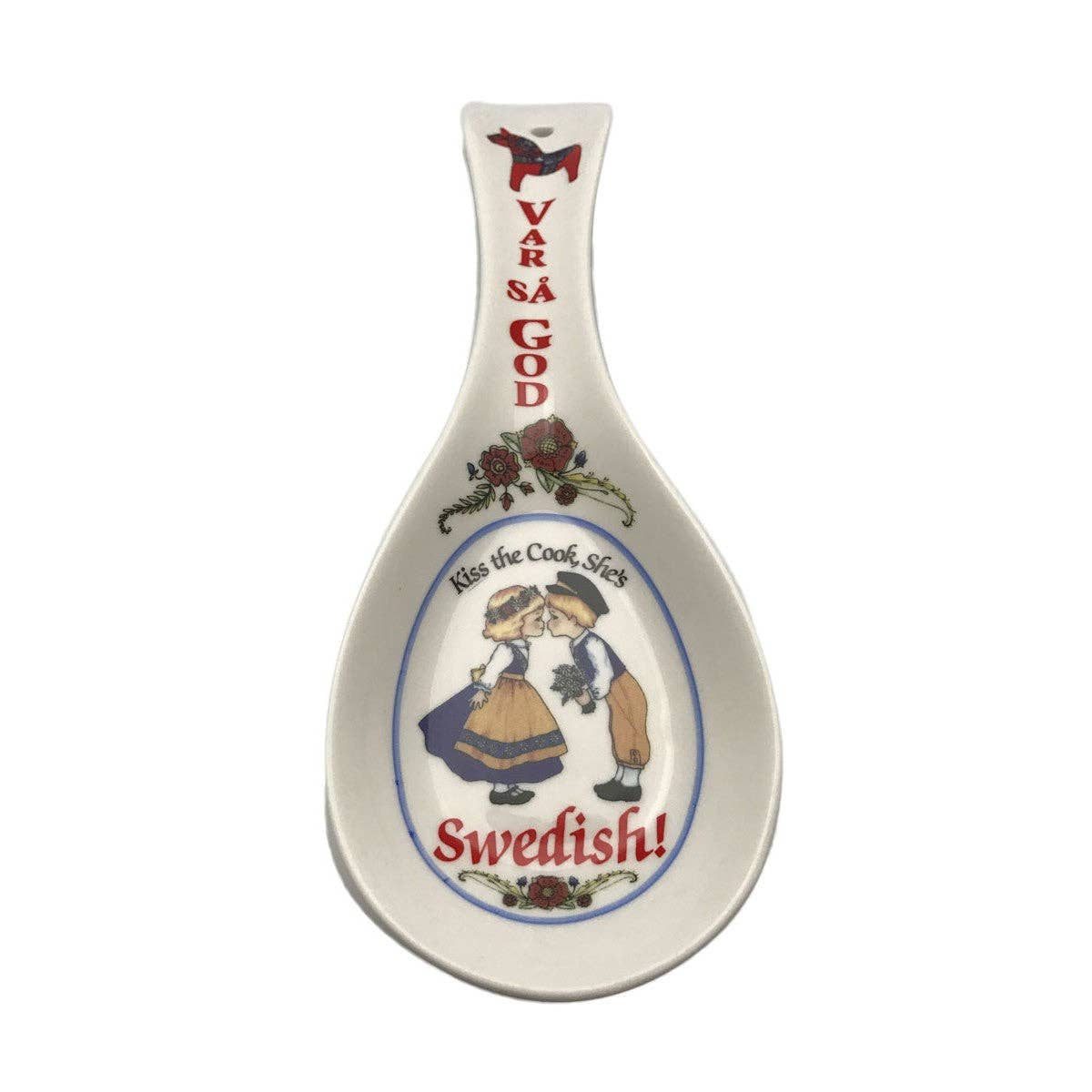 The charming "Var Sa God" ceramic spoon rest serves as both a functional kitchen accessory and decor, showcasing the phrase "Kiss the Cook, She’s Swedish!" alongside a delightful illustration of a woman in traditional attire. It's the perfect gift for anyone who enjoys cooking with a dash of Swedish cultural flair.