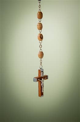 The Rosary: Olive Wood Rosary with Crucifix - 30 features handcrafted olive wood beads and a metal crucifix, displayed against a plain light green background.