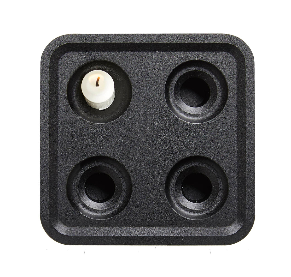 The Stumpastaken Fyran is a white, square candle holder with four round slots, crafted from 100% recycled material. Swedish-designed and powder-coated, it brings sustainable style to any interior.