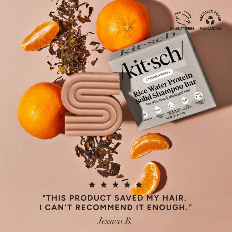 The Kitsch Hair: Rice Water Shampoo & Conditioner Bar Combo for Hair Growth (2 x 2.7oz) is shown with orange slices and tea leaves on a beige background, alongside customer feedback on hair growth and eco-friendly symbols.