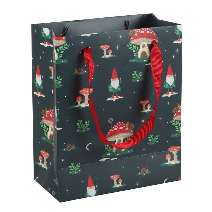 Gift Bag: Gnome Sweet Gnome (7.5"w x 9"h x 3.5"d) comes with red handles and a green background, adorned with charming images of gnomes, mushrooms, and a mushroom house surrounded by foliage. This printed gift bag exudes festive magic with its winter forest-inspired design.