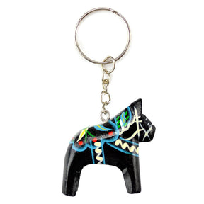 Black Dala horse keychain featuring colorful patterns, attached to a silver metal ring.