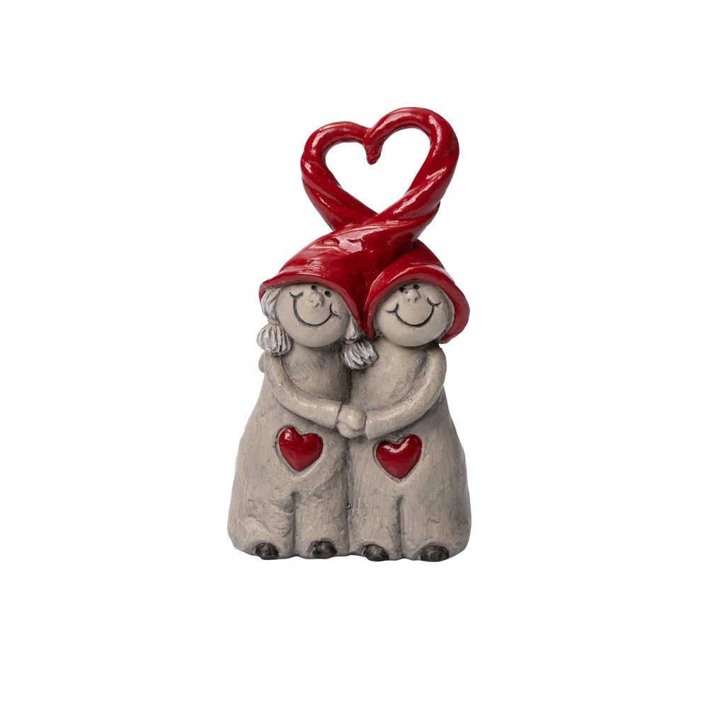 Two hand-painted Tittut Tomten figurines with red hats and heart-shaped handles, embracing with red heart motifs on their clothing.