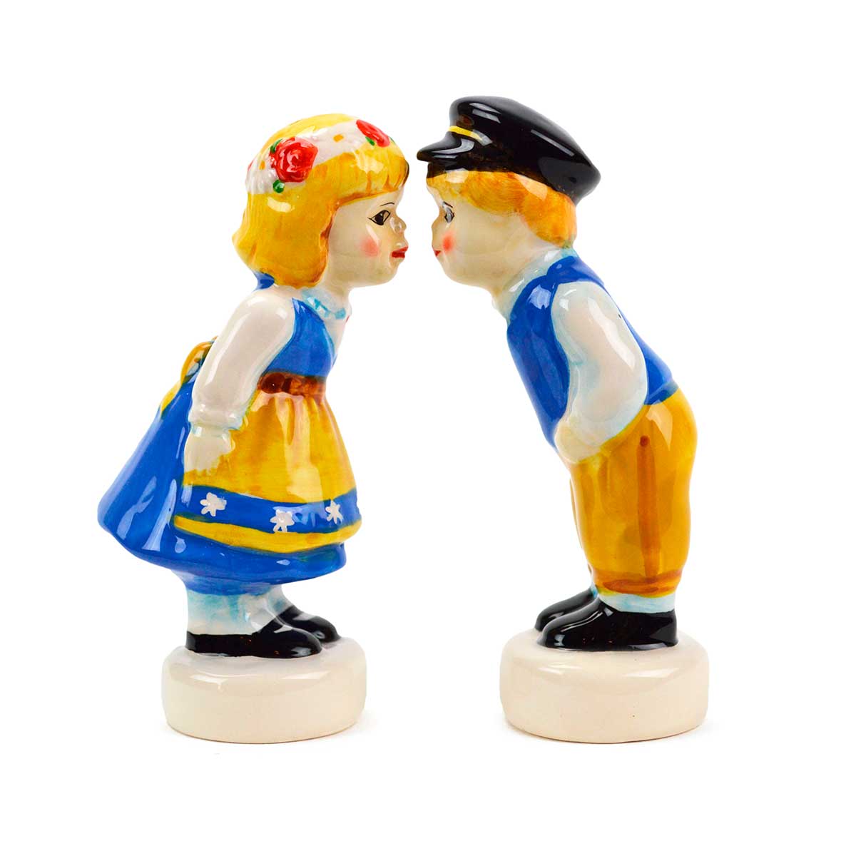The charming Swedish Standing Couple figurines depict a girl and boy in traditional attire leaning toward each other. They double as vintage ceramic salt and pepper shakers, perfect for enhancing your kitchen decor.