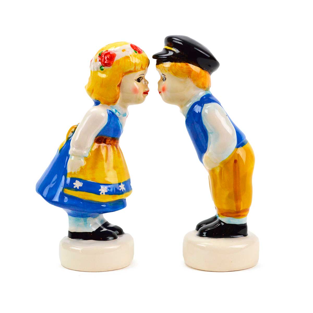 A charming duo of ceramic figurines featuring a girl in a blue and yellow floral dress and a boy in a blue vest, yellow pants, and a hat. This elegant pair serves as the "Vintage Salt & Pepper Shakers Swedish Standing Couple," perfect for adding both beauty and functionality to your kitchen decor.