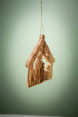 The "Stable with Nativity and Animals" 3" Christmas tree ornament hangs from a gold string against a green background.
