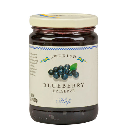 The Hafi Blueberry Preserves Jar, 14.1 oz, made in Sweden from wild Swedish blueberries, features a beige lid and a label with blueberries and Swedish flags, offering an authentic taste experience.