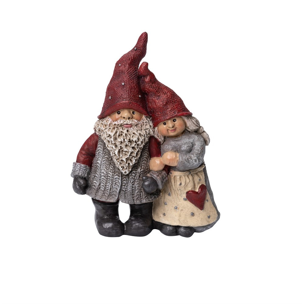 Two delightful figurines from the Family Hakansson collection feature gnomes with red hats; one resembles Santa Håkan with a gray beard and sweater, while the other appears to be Santa Mother Stina, wearing a dress adorned with a heart.