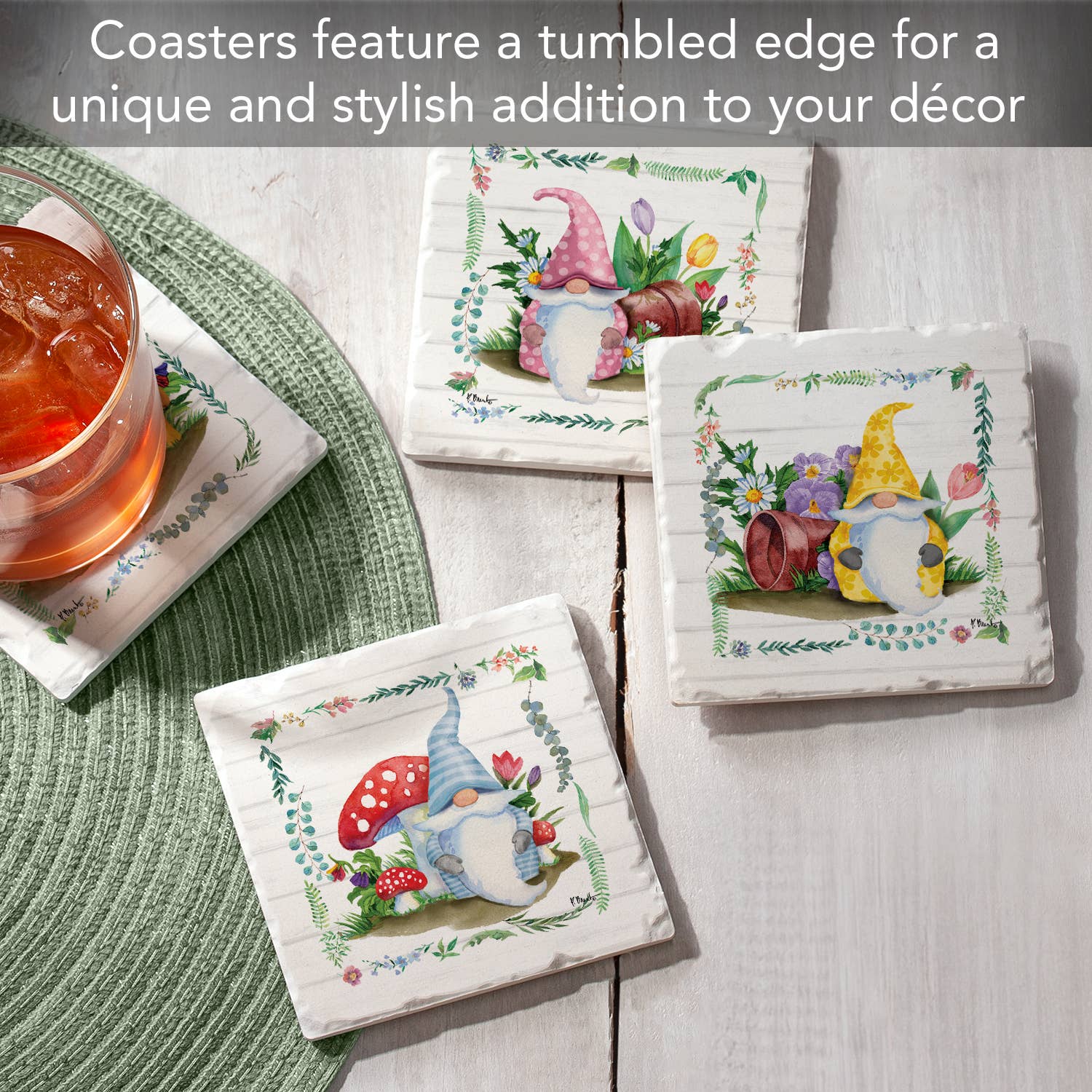 A set of decorative coasters featuring gnomes and mushrooms adorns a table. One iced drink sits on an absorbent stone coaster. Text above highlights the charm of these Coaster: Spring Gnomes Tumbled Tile Coasters with Cork Back, 4 Images in a 4 Pack.