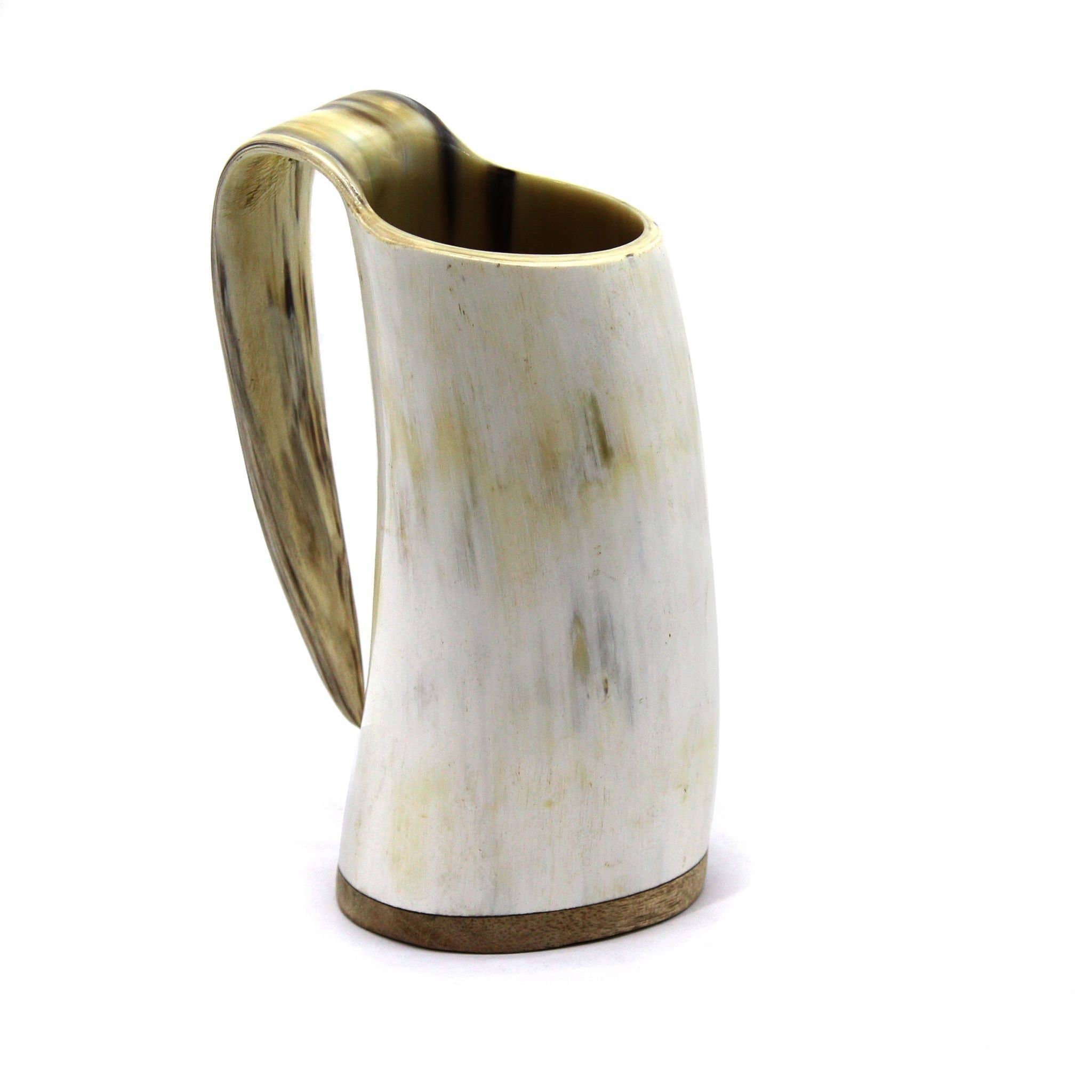 A 16oz Viking African ox horn mug with a wide base and an arched handle, showcasing its large white and brown design, stands upright on a white background, capturing the essence of an authentic beer ox horn tankard.