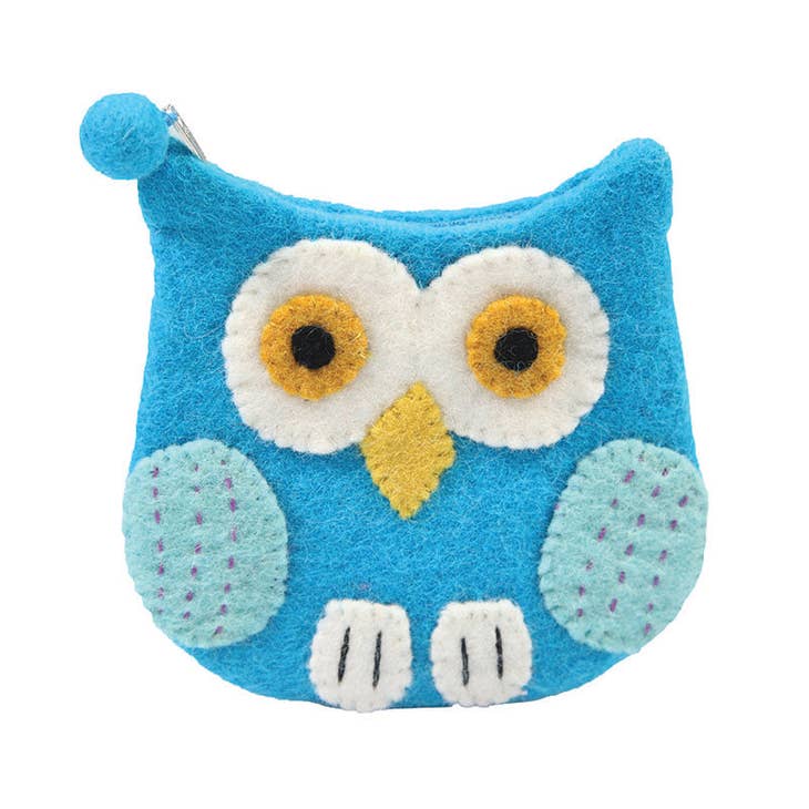 The Bag: Felted Wool Owl-Shaped Cosmetic Bag or Coin Purse is a handcrafted item made from blue wool felt, showcasing large eyes and a yellow beak, with a zipper closure on top.