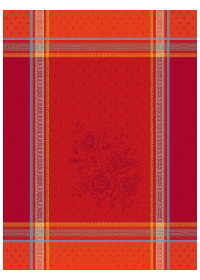The Bouquet Red Tea Towel is a 20"x28" woven cotton tea towel with red and orange plaid, gray and yellow stripes, and a subtle central floral motif inspired by Provençal design, made using traditional jacquard weaving.