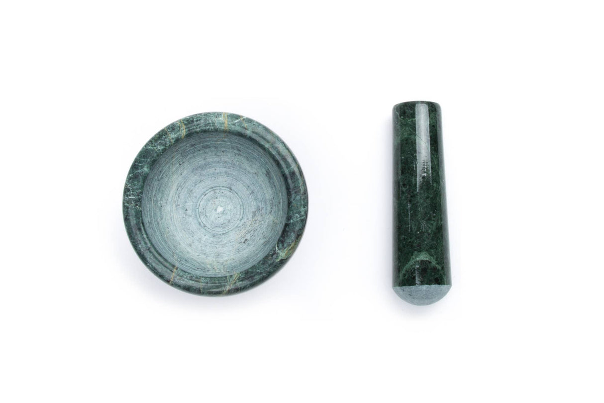 The Marble Mortar and Pestle in green (3.5" x 3.5") features an unpolished interior, with the bowl on the left and cylindrical pestle on the right, displayed against a white background.