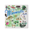 The MN State Ceramic Coaster by Rosanne Beck features iconic Minnesota images like the Minnesota text, moose, fish, loon, state flower, pine tree, Stone Arch Bridge cityscape, hockey stick, canoe, and winter activities—an ideal keepsake for any Paul Bunyan enthusiast!.