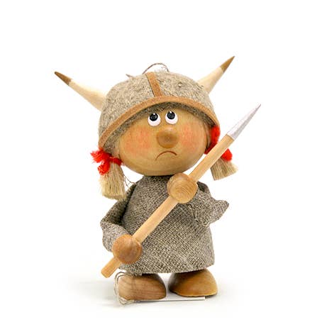 The Figurine: Viking Girl with Spear features a small handcrafted Scandinavian design, showcasing a girl in a horned helmet holding a wooden spear.