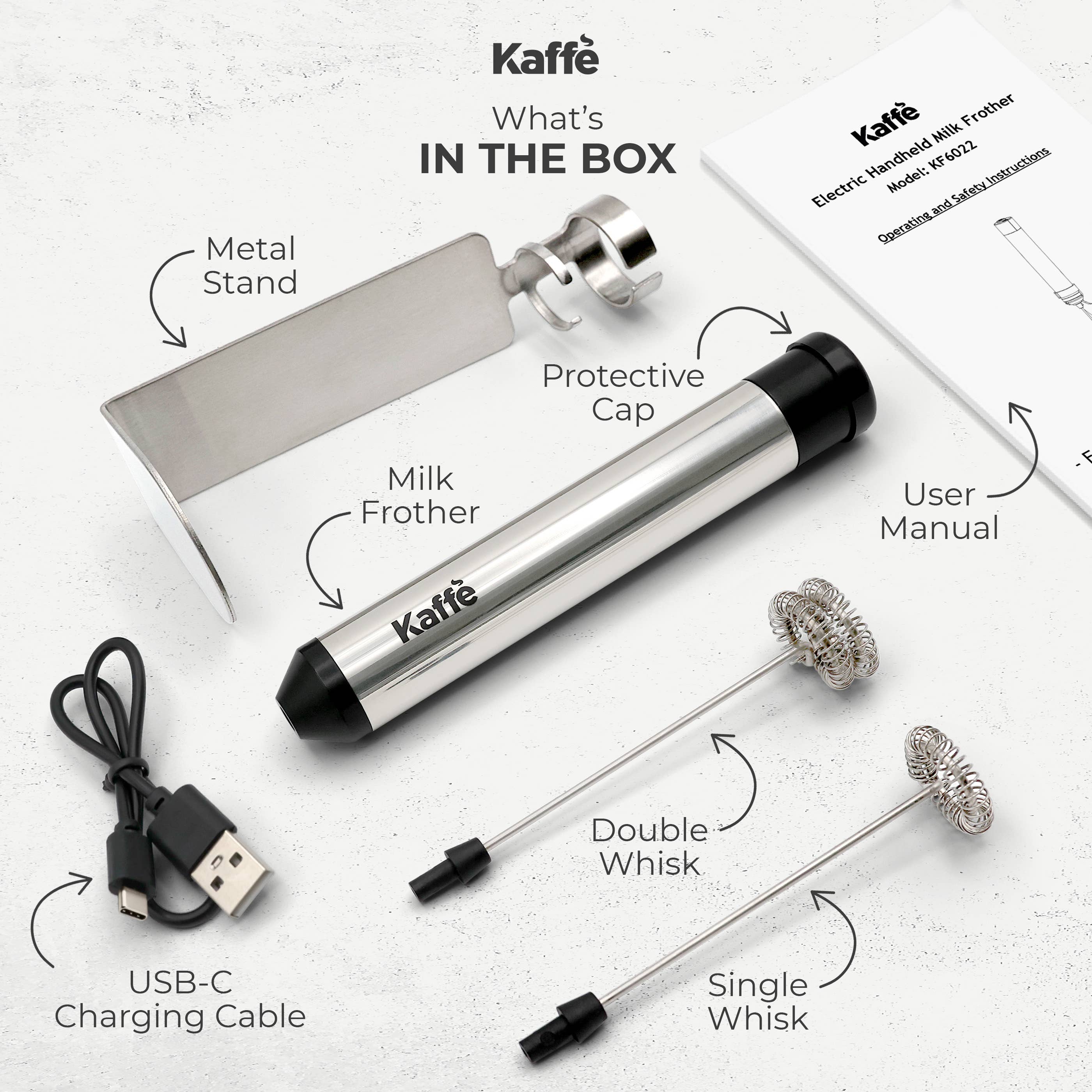 The Kaffe Handheld Milk Frother with Stand (Stainless Steel) includes a metal stand, protective cap, USB-C charging cable, double and single whisks, and user manual. This frother is USB rechargeable for convenience.