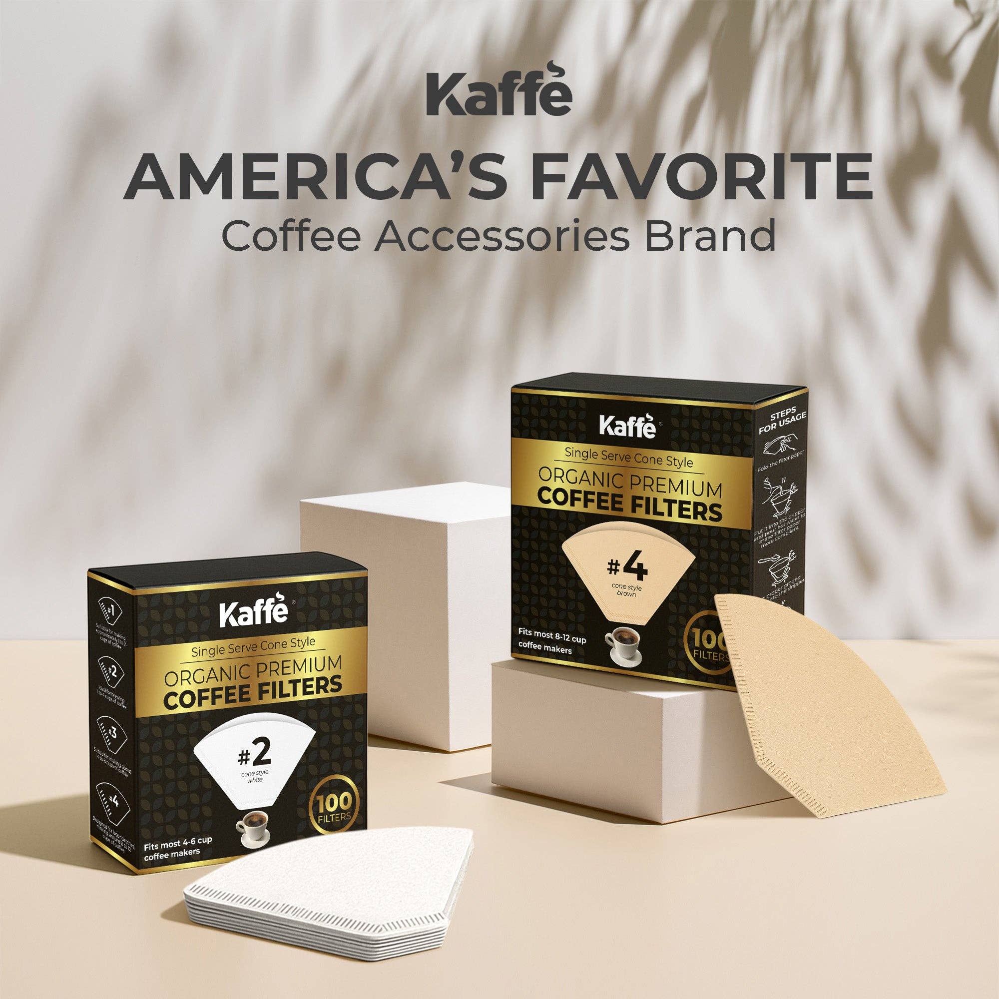 A box of Coffee Filters: Organic Premium Coffee Filters #2 is displayed with unbleached filters on a beige background with geometric props—ideal for 4–6 cup coffee makers.