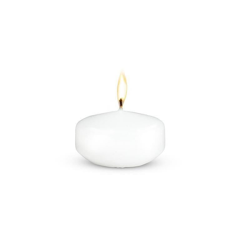 The 2" Floater Tealight Candle in white, when lit, creates a cozy atmosphere.