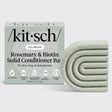 A KITSCH Rosemary & Biotin Volumizing Hair Conditioner Bar 2.7 oz rests beside its box, which is labeled for fine, limp, and delicate hair types. The pale green bar displays a geometric arched pattern, while the packaging emphasizes benefits suited for anyone seeking a lightweight rosemary biotin conditioner to boost body and volume in fine hair.