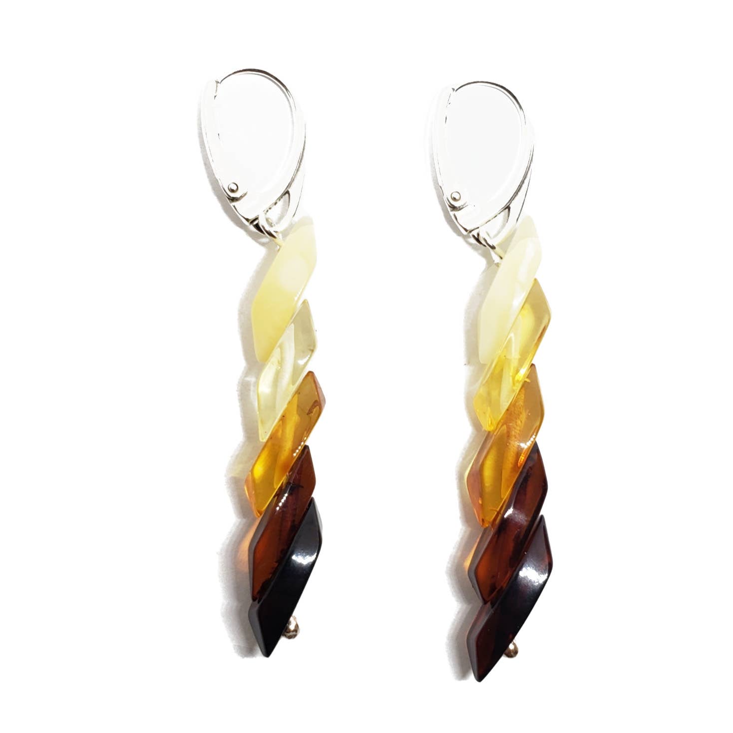 Dangling earrings with twisted beads in white, yellow, Baltic amber, and dark brown shades feature sterling silver hooks. Product: Multi-Color Genuine Baltic Amber Rainbow Earrings.